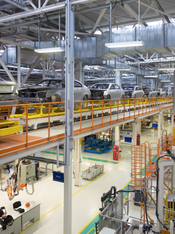 body of car on conveyor Modern Assembly of cars at plant. automated build process of car body